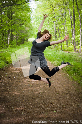 Image of Joyful Jumping Woman