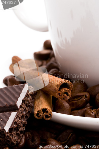 Image of coffee, beans, cinnamon and black chocolate