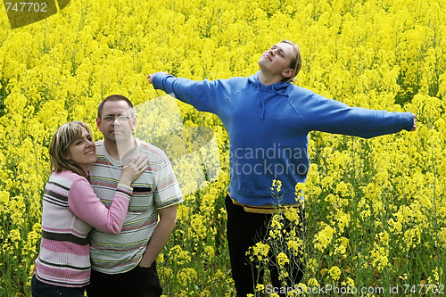 Image of Three people in meadow