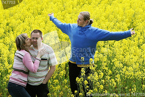 Image of Three people in meadow