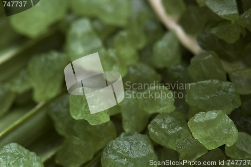 Image of bath salt and palm leaf