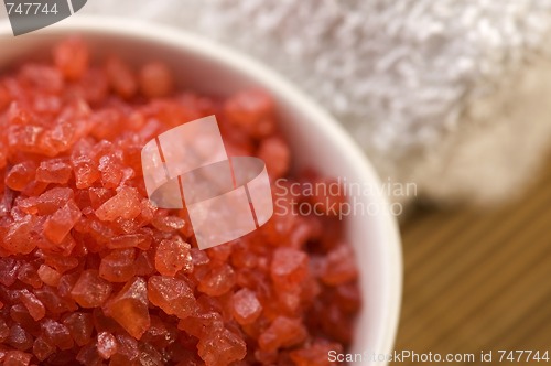 Image of bath salt and towel. red and white