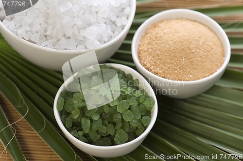 Image of bath salt and palm leaf