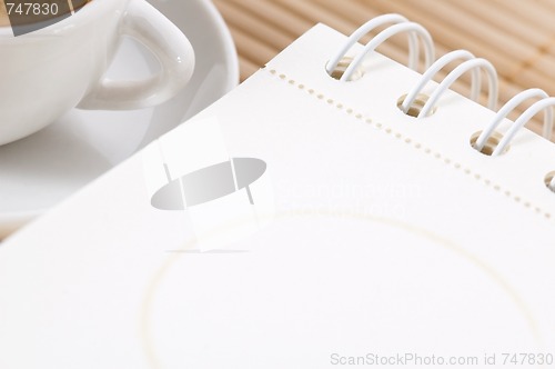 Image of notebook and cup of coffee