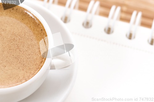 Image of notebook and cup of coffee