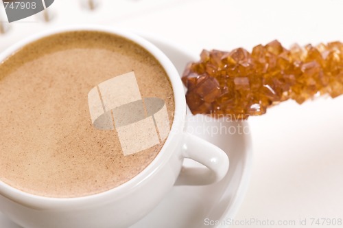 Image of notebook, sugar and cup of coffee