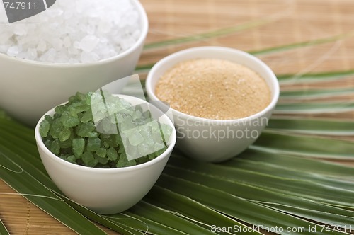 Image of bath salt and palm leaf