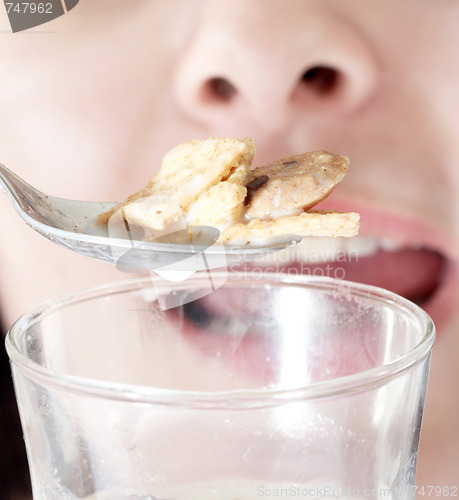 Image of Young people eating milk with cereals