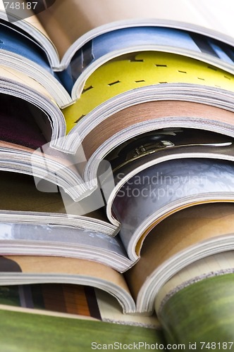 Image of Stack of open magazines