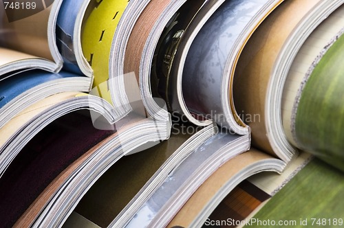 Image of Stack of open magazines