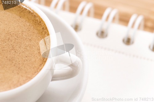 Image of notebook and cup of coffee