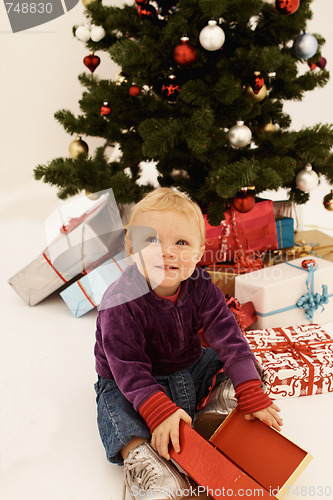 Image of Christmas - Cute child opening Gifts