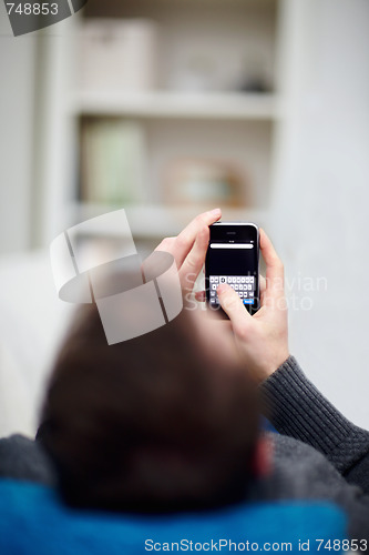 Image of New Technology - Man  writing sms on cell phone