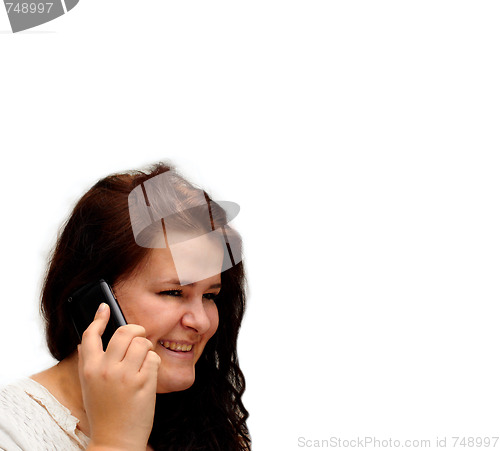 Image of Happy young woman talking on mobile phone