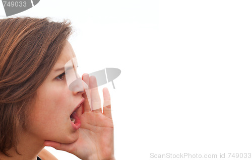 Image of Young woman screaming at copy space