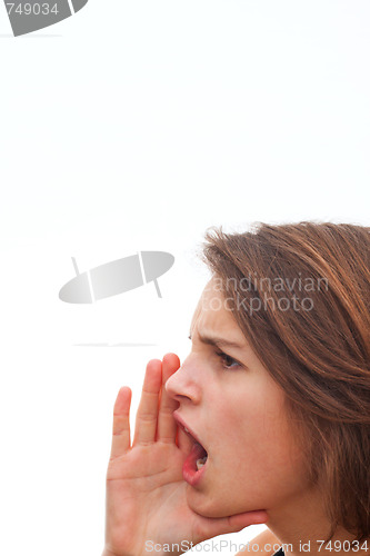 Image of Young woman screaming at white background