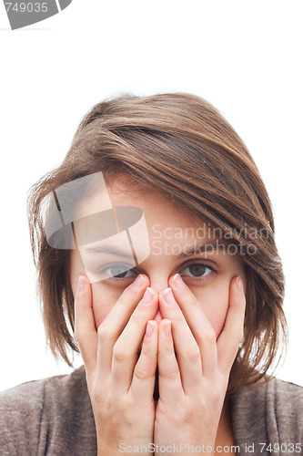 Image of Woman covering her face with hands