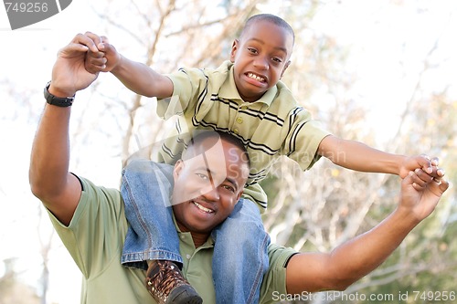Image of African American Man and Child Having Fun