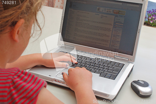 Image of Girl at her laptop.