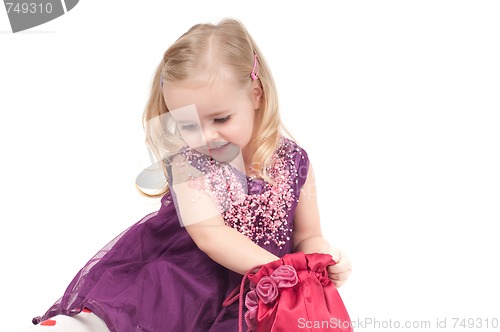 Image of Studio shot of baby girl in gala dress