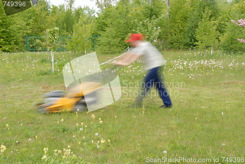 Image of mowing grass