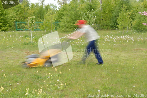 Image of mowing grass