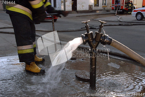 Image of Hydrant and fireman