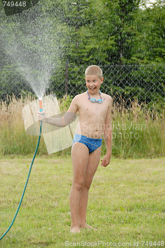 Image of boy play with water