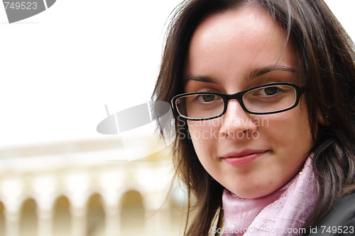 Image of Young girl with glasses and scarf