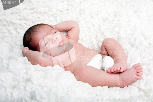 Image of Cute baby asleep on cloud