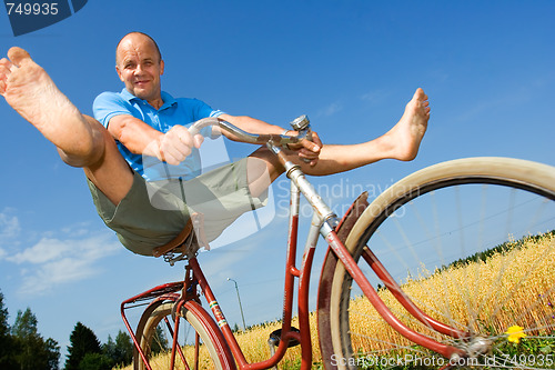 Image of Man bicycling