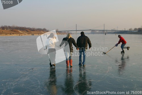 Image of Family walking on ice