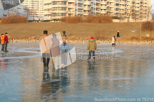 Image of Family walking on ice