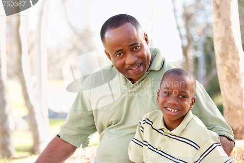 Image of Attractive African American Man and Child Having Fun