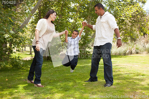Image of Young Hispanic Family Having Fun in the Park