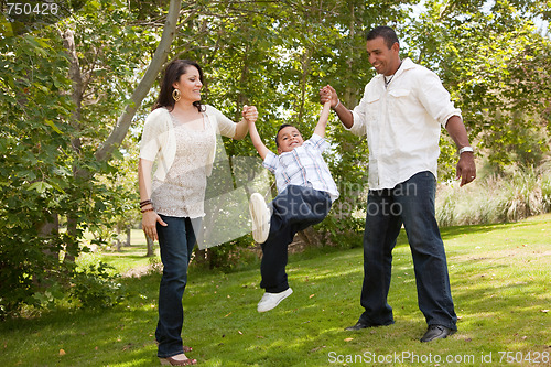 Image of Young Hispanic Family Having Fun in the Park