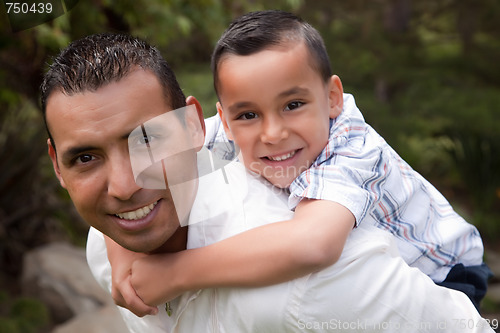 Image of Hispanic Father and Son Having Fun in the Park