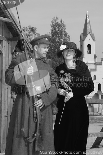 Image of Retro style picture with woman and soldier