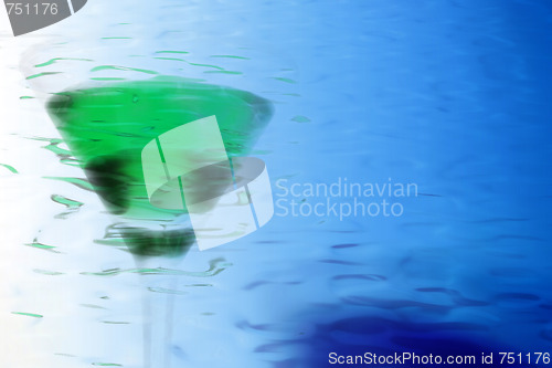 Image of abstract scene of the liquor-glass on varicoloured background