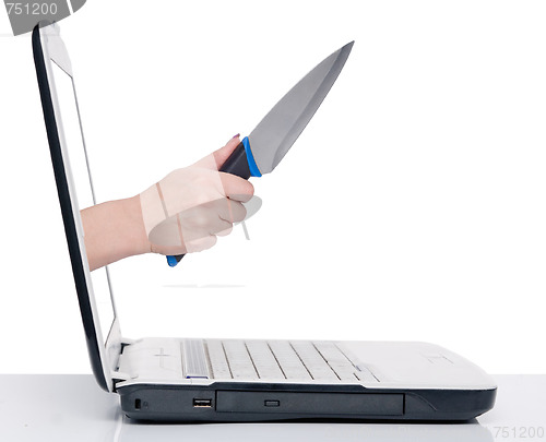 Image of hand with knife and laptop