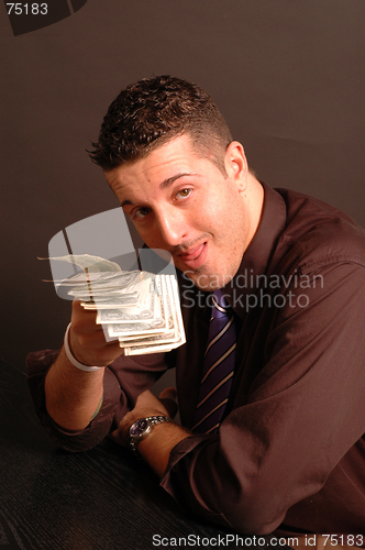 Image of cash in hand 2440