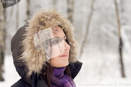 Image of Woman in forest with fur hood