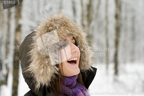 Image of Woman in forest with fur hood