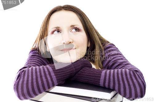 Image of woman preperaing for exam with toons of books