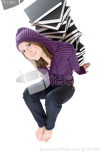 Image of Woman sitting with pile of books