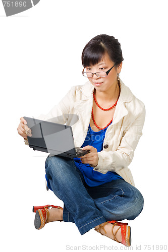 Image of Asian woman sitting with netbook