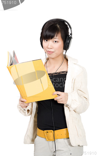 Image of Asian girl in headphones with yellow book