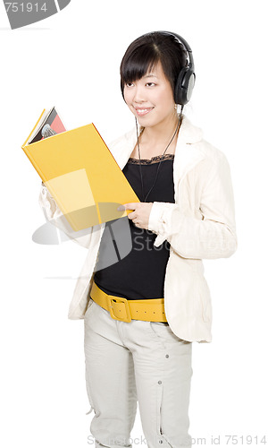 Image of Asian woman with yellow book and headphones