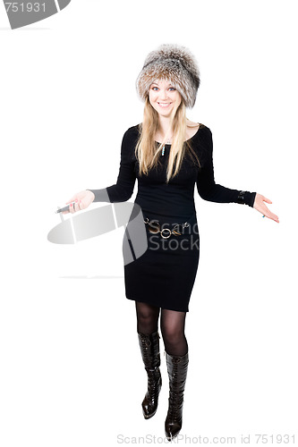 Image of Blond Russian woman in fur hat speaking on telephone