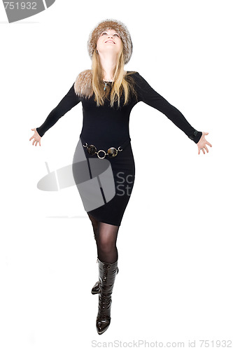 Image of Blond Russian woman in fur hat speaking on telephone